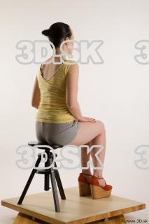 Sitting reference of whole body yellow t shirt gray shorts…